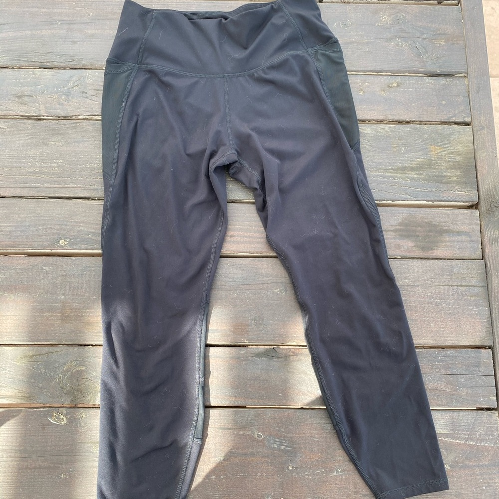 Black compression leggings with mesh cutouts